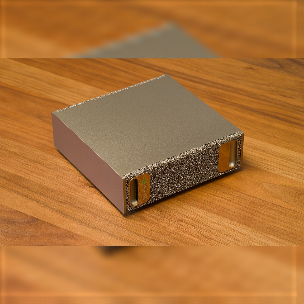 Photo of an NVIDIA DGX Spark on a wooden desk, one device in the initial local AI agent benchmark; photo by Daniel Lu