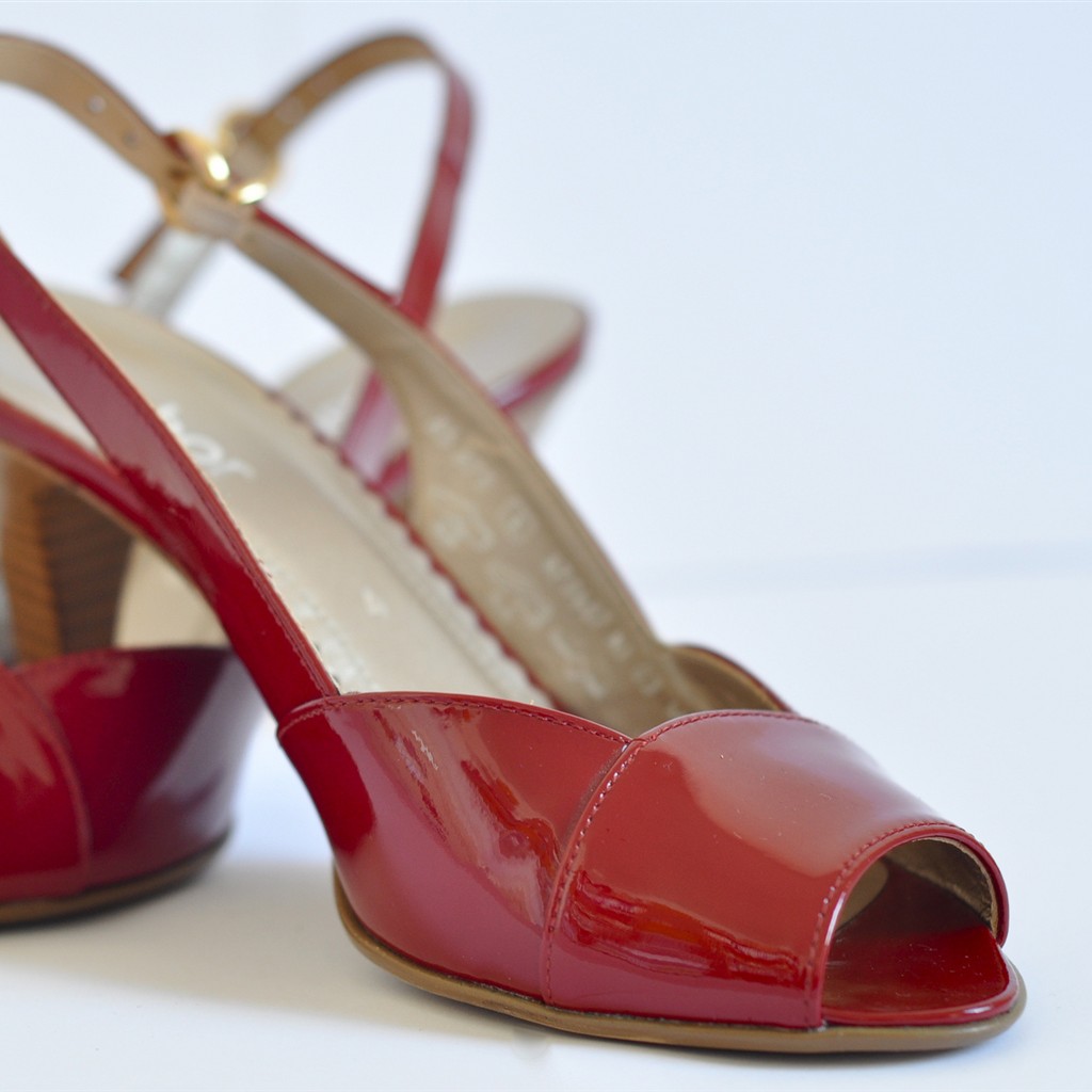 An authentic photograph of red shoes for a product catalogue, cropped square; not an image generated by Qwen-Image-2.1