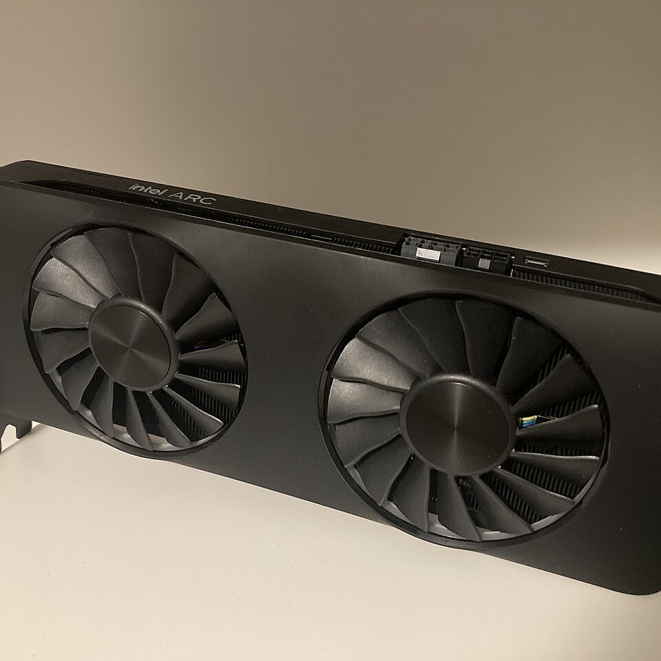 Real photograph of a dual-fan Intel Arc A770 graphics card, illustrating local GPU inference without implying this card was benchmarked for OpenVINO 2026.4